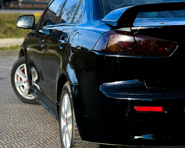 Черный Мицубиси Лансер, объемом двигателя 2 л и пробегом 333 тыс. км за 7300 $, фото 6 на Automoto.ua