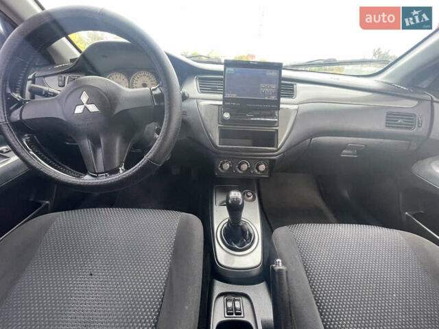 Чорний Міцубісі Lancer, об'ємом двигуна 1.6 л та пробігом 162 тис. км за 4650 $, фото 13 на Automoto.ua