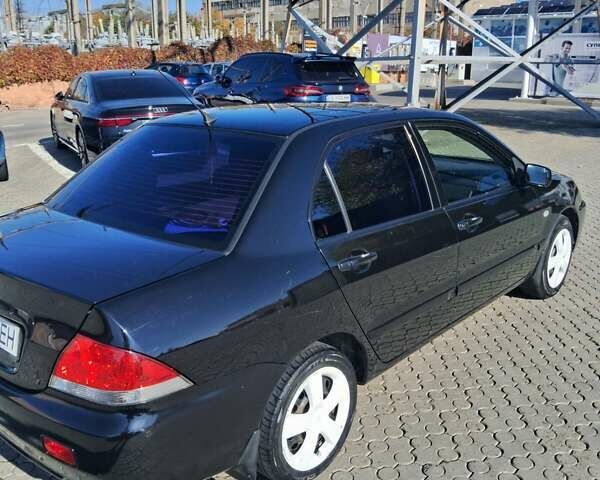 Міцубісі Lancer 2007 у Чернівцях на Automoto.ua Чорний Міцубісі Lancer, об'ємом двигуна 1.58 л та пробігом 247 тис. км за 4300 $, фото 2 на Automoto.ua