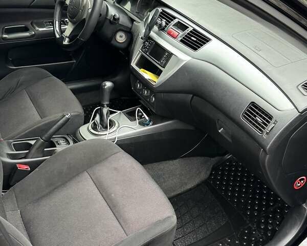 Черный Мицубиси Лансер, объемом двигателя 2 л и пробегом 219 тыс. км за 4400 $, фото 6 на Automoto.ua