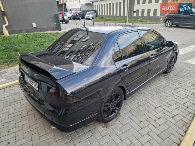 Чорний Міцубісі Lancer, об'ємом двигуна 2 л та пробігом 272 тис. км за 4750 $, фото 9 на Automoto.ua