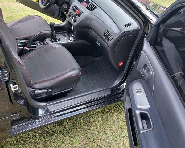 Черный Мицубиси Лансер, объемом двигателя 1.6 л и пробегом 210 тыс. км за 5500 $, фото 6 на Automoto.ua