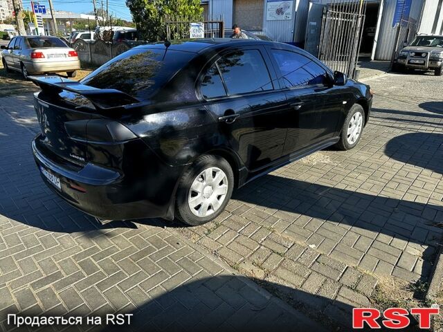 Черный Мицубиси Лансер, объемом двигателя 2 л и пробегом 250 тыс. км за 5900 $, фото 2 на Automoto.ua