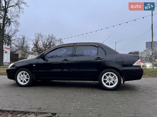 Чорний Міцубісі Lancer, об'ємом двигуна 1.6 л та пробігом 303 тис. км за 4350 $, фото 18 на Automoto.ua