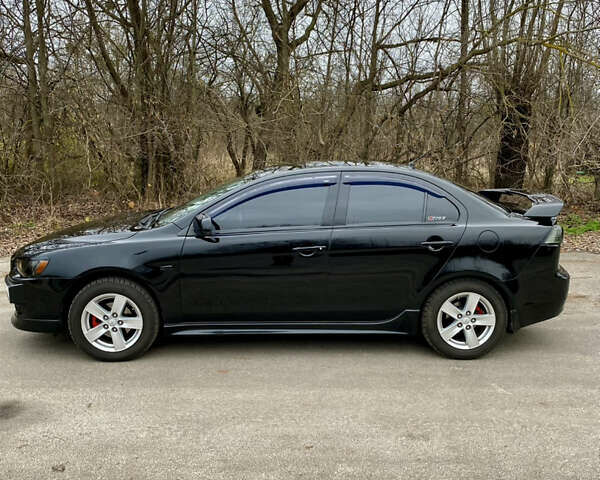 Черный Мицубиси Лансер, объемом двигателя 2 л и пробегом 164 тыс. км за 8300 $, фото 12 на Automoto.ua