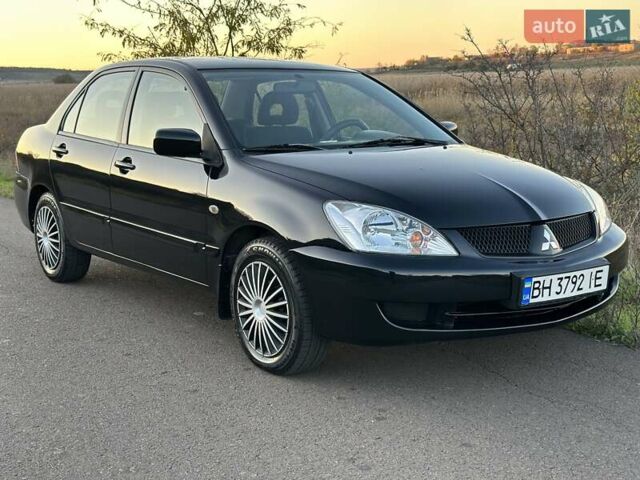 Черный Мицубиси Лансер, объемом двигателя 1.58 л и пробегом 139 тыс. км за 5200 $, фото 11 на Automoto.ua