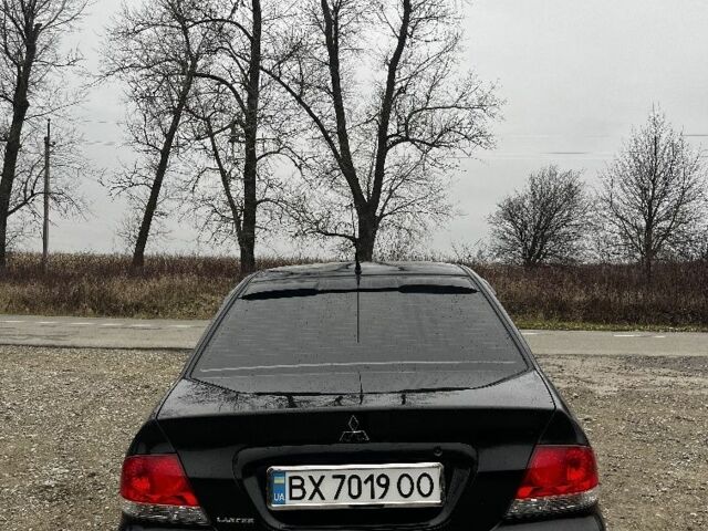 Черный Мицубиси Лансер, объемом двигателя 1.6 л и пробегом 272 тыс. км за 2800 $, фото 3 на Automoto.ua