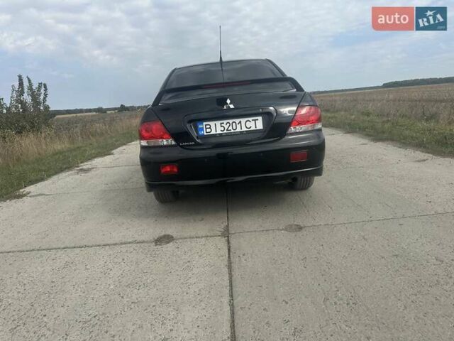 Чорний Міцубісі Lancer, об'ємом двигуна 1.6 л та пробігом 310 тис. км за 5100 $, фото 17 на Automoto.ua