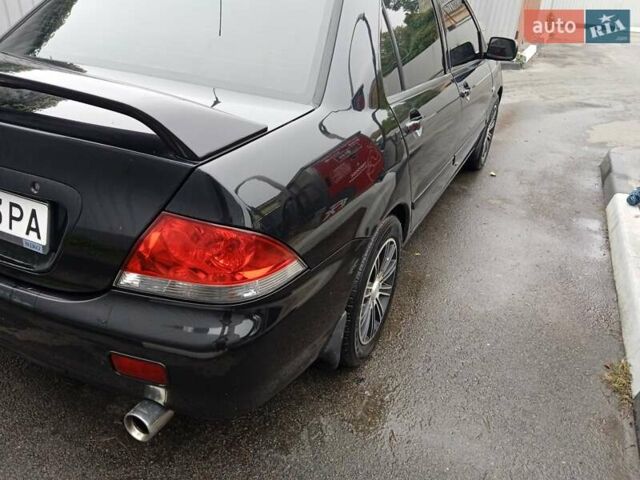 Черный Мицубиси Лансер, объемом двигателя 1.58 л и пробегом 180 тыс. км за 4500 $, фото 7 на Automoto.ua