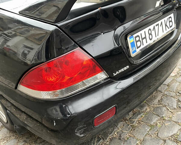 Чорний Міцубісі Lancer, об'ємом двигуна 1.6 л та пробігом 213 тис. км за 3000 $, фото 5 на Automoto.ua