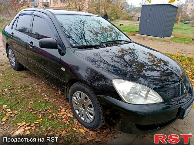 Чорний Міцубісі Lancer, об'ємом двигуна 1.6 л та пробігом 227 тис. км за 4100 $, фото 1 на Automoto.ua