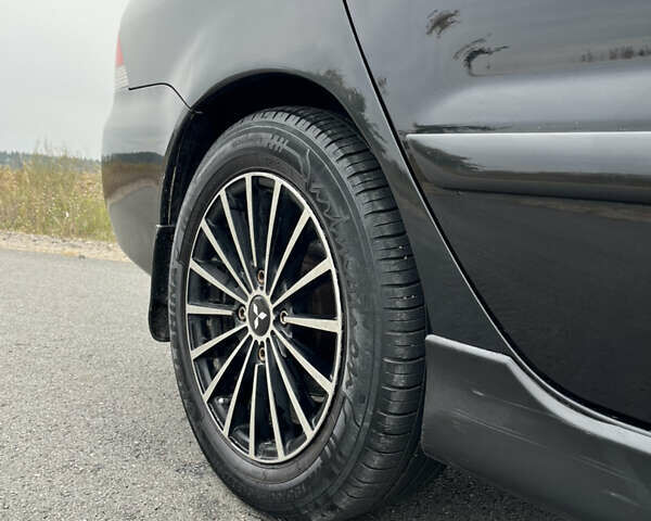 Чорний Міцубісі Lancer, об'ємом двигуна 1.6 л та пробігом 212 тис. км за 4700 $, фото 5 на Automoto.ua