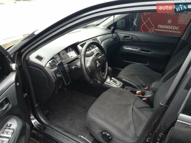 Черный Мицубиси Лансер, объемом двигателя 1.58 л и пробегом 180 тыс. км за 4500 $, фото 6 на Automoto.ua