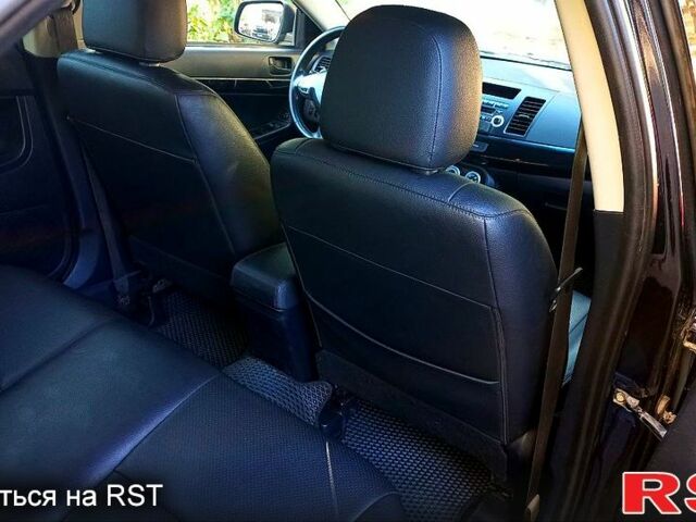 Черный Мицубиси Лансер, объемом двигателя 2 л и пробегом 290 тыс. км за 5800 $, фото 3 на Automoto.ua