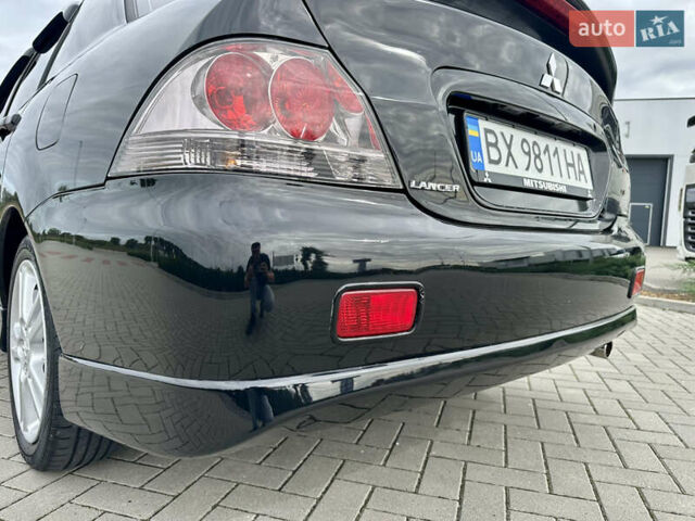 Чорний Міцубісі Lancer, об'ємом двигуна 2 л та пробігом 275 тис. км за 5300 $, фото 26 на Automoto.ua