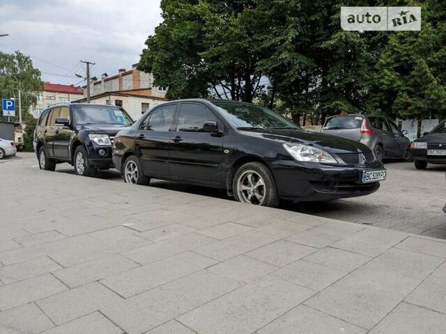 Чорний Міцубісі Lancer, об'ємом двигуна 1.6 л та пробігом 130 тис. км за 5500 $, фото 35 на Automoto.ua