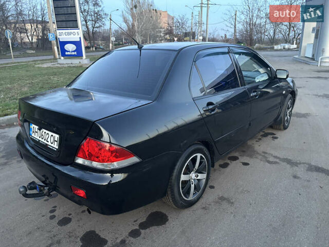 Черный Мицубиси Лансер, объемом двигателя 1.6 л и пробегом 315 тыс. км за 4000 $, фото 1 на Automoto.ua