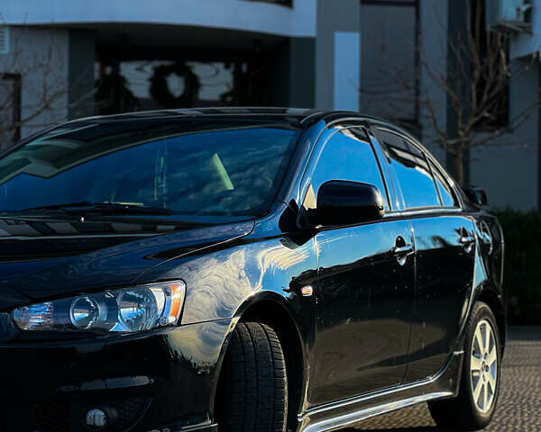 Черный Мицубиси Лансер, объемом двигателя 2 л и пробегом 333 тыс. км за 7300 $, фото 5 на Automoto.ua