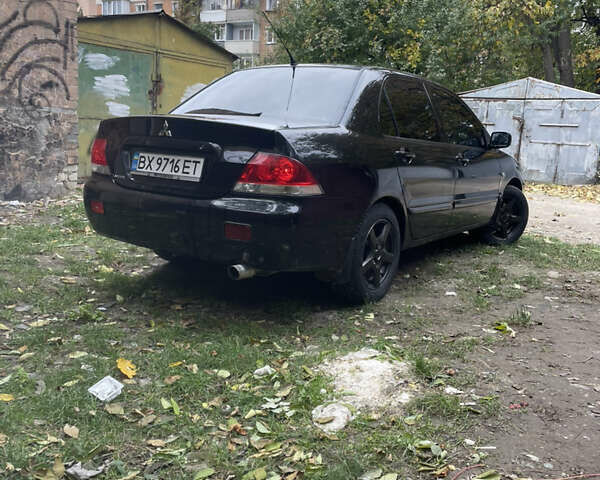 Черный Мицубиси Лансер, объемом двигателя 1.6 л и пробегом 258 тыс. км за 3099 $, фото 2 на Automoto.ua