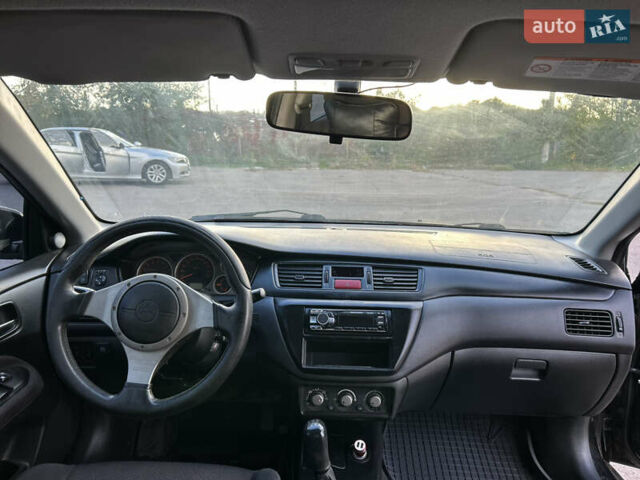 Чорний Міцубісі Lancer, об'ємом двигуна 2 л та пробігом 280 тис. км за 4600 $, фото 35 на Automoto.ua