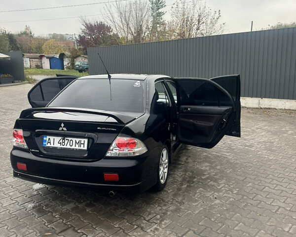Чорний Міцубісі Lancer, об'ємом двигуна 2 л та пробігом 210 тис. км за 5500 $, фото 15 на Automoto.ua