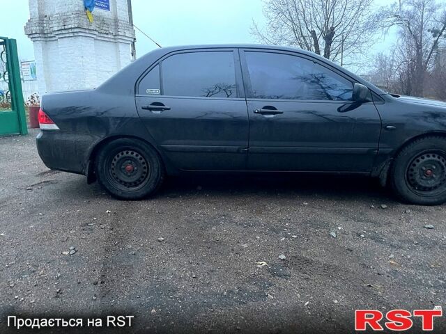 Чорний Міцубісі Lancer, об'ємом двигуна 1.6 л та пробігом 201 тис. км за 4000 $, фото 4 на Automoto.ua