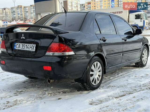 Чорний Міцубісі Lancer, об'ємом двигуна 1.6 л та пробігом 190 тис. км за 3450 $, фото 5 на Automoto.ua