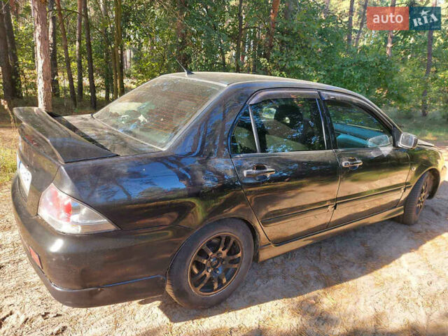 Чорний Міцубісі Lancer, об'ємом двигуна 2 л та пробігом 290 тис. км за 3300 $, фото 4 на Automoto.ua