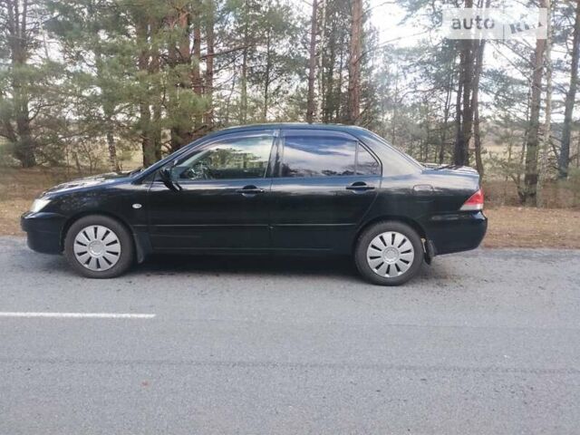 Чорний Міцубісі Lancer, об'ємом двигуна 1.58 л та пробігом 210 тис. км за 4200 $, фото 6 на Automoto.ua