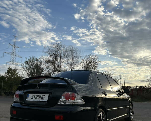 Чорний Міцубісі Lancer, об'ємом двигуна 2 л та пробігом 280 тис. км за 4600 $, фото 26 на Automoto.ua