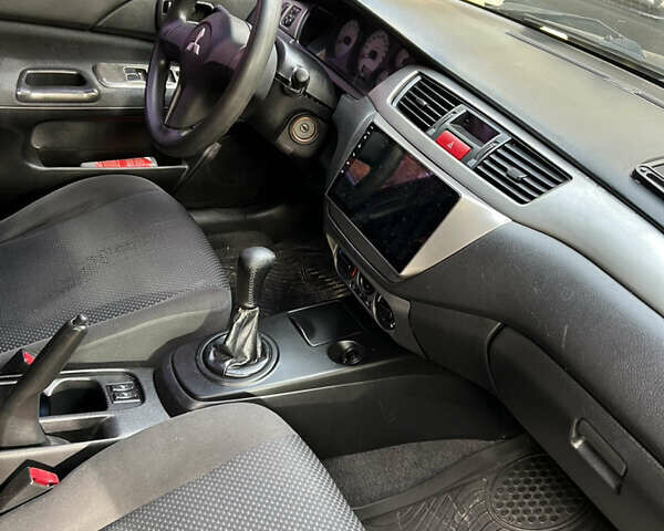 Чорний Міцубісі Lancer, об'ємом двигуна 1.58 л та пробігом 234 тис. км за 3800 $, фото 10 на Automoto.ua