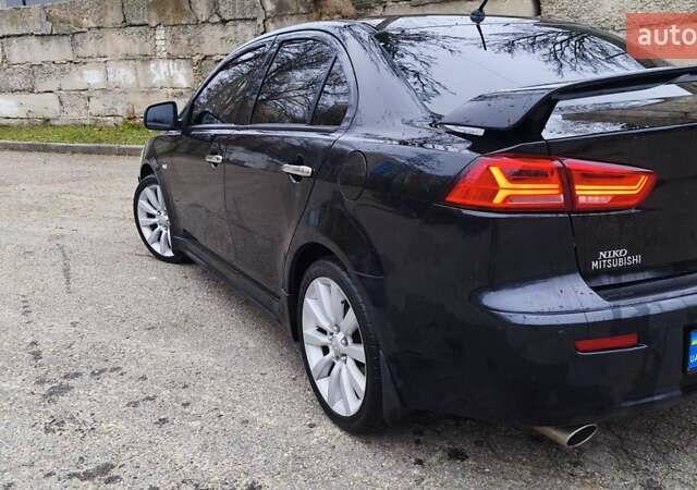Черный Мицубиси Лансер, объемом двигателя 2 л и пробегом 230 тыс. км за 7100 $, фото 8 на Automoto.ua