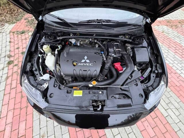 Черный Мицубиси Лансер, объемом двигателя 2 л и пробегом 217 тыс. км за 5500 $, фото 11 на Automoto.ua