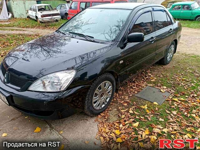 Чорний Міцубісі Lancer, об'ємом двигуна 1.6 л та пробігом 227 тис. км за 4100 $, фото 5 на Automoto.ua