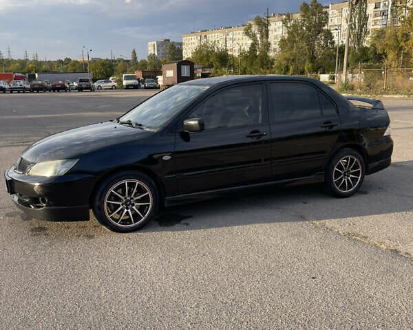 Чорний Міцубісі Lancer, об'ємом двигуна 2 л та пробігом 280 тис. км за 4600 $, фото 9 на Automoto.ua