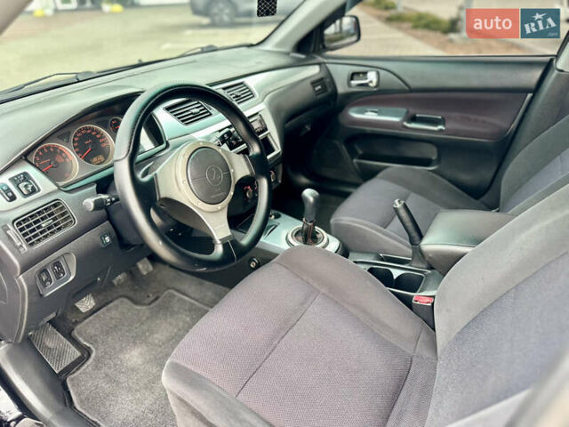 Чорний Міцубісі Lancer, об'ємом двигуна 2 л та пробігом 275 тис. км за 5300 $, фото 35 на Automoto.ua