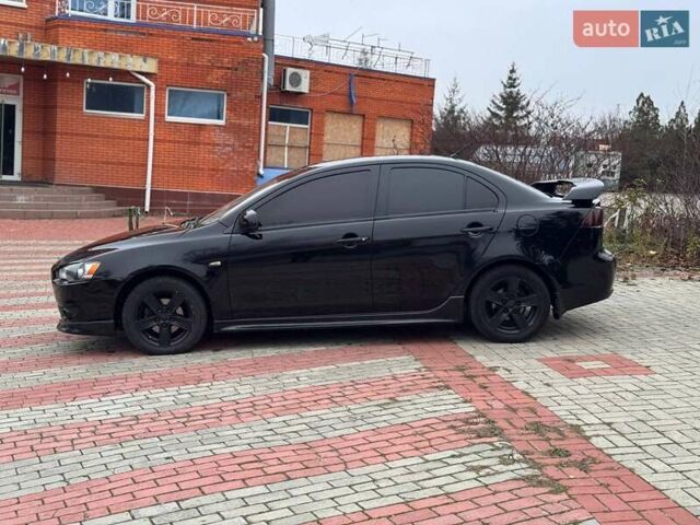 Черный Мицубиси Лансер, объемом двигателя 2 л и пробегом 217 тыс. км за 5500 $, фото 4 на Automoto.ua