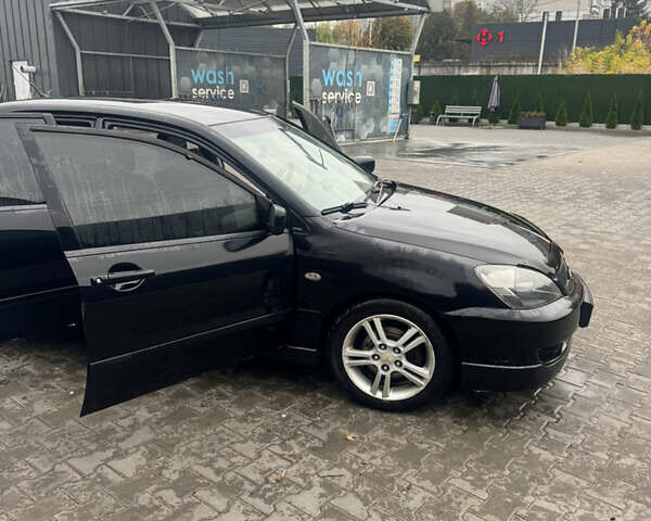 Чорний Міцубісі Lancer, об'ємом двигуна 2 л та пробігом 210 тис. км за 5500 $, фото 17 на Automoto.ua