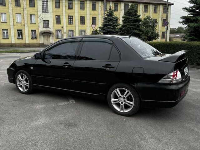 Чорний Міцубісі Lancer, об'ємом двигуна 2 л та пробігом 222 тис. км за 4900 $, фото 1 на Automoto.ua