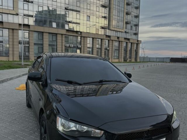 Черный Мицубиси Лансер, объемом двигателя 2 л и пробегом 242 тыс. км за 6200 $, фото 1 на Automoto.ua