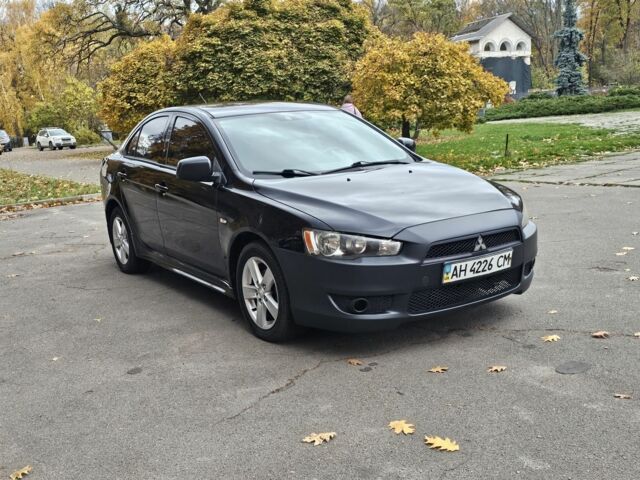 Черный Мицубиси Лансер, объемом двигателя 2 л и пробегом 115 тыс. км за 5000 $, фото 11 на Automoto.ua