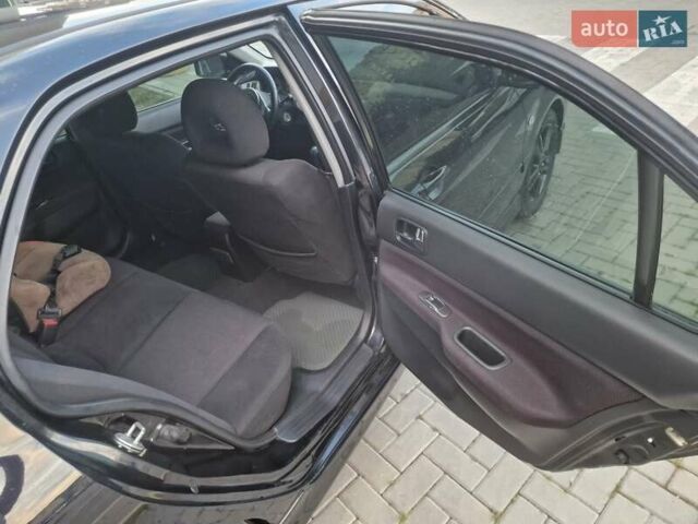 Чорний Міцубісі Lancer, об'ємом двигуна 2 л та пробігом 272 тис. км за 4750 $, фото 20 на Automoto.ua
