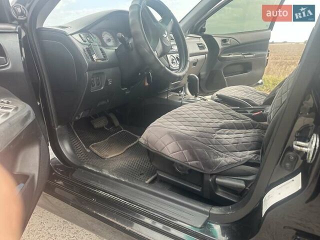 Чорний Міцубісі Lancer, об'ємом двигуна 1.6 л та пробігом 310 тис. км за 5100 $, фото 4 на Automoto.ua