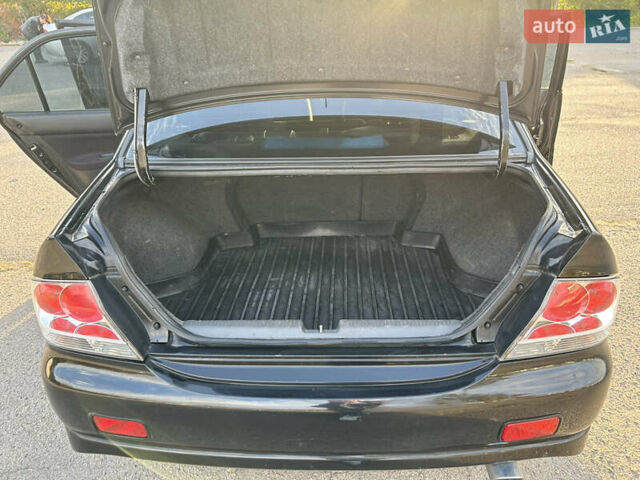 Чорний Міцубісі Lancer, об'ємом двигуна 2 л та пробігом 280 тис. км за 4600 $, фото 47 на Automoto.ua