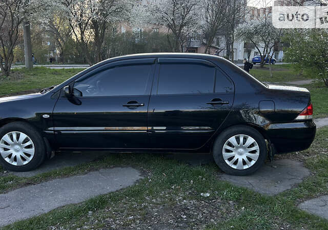 Чорний Міцубісі Lancer, об'ємом двигуна 1.58 л та пробігом 161 тис. км за 5300 $, фото 8 на Automoto.ua