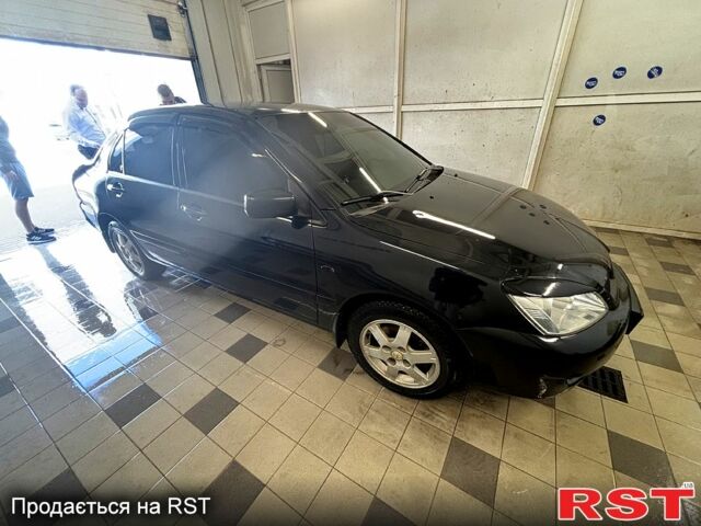 Черный Мицубиси Лансер, объемом двигателя 1.6 л и пробегом 249 тыс. км за 4444 $, фото 1 на Automoto.ua