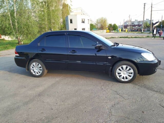 Черный Мицубиси Лансер, объемом двигателя 1.6 л и пробегом 32 тыс. км за 9000 $, фото 10 на Automoto.ua