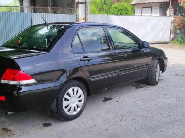 Чорний Міцубісі Lancer, об'ємом двигуна 0.16 л та пробігом 240 тис. км за 3850 $, фото 3 на Automoto.ua