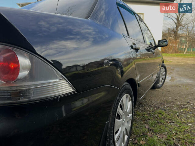 Чорний Міцубісі Lancer, об'ємом двигуна 1.58 л та пробігом 185 тис. км за 3750 $, фото 5 на Automoto.ua
