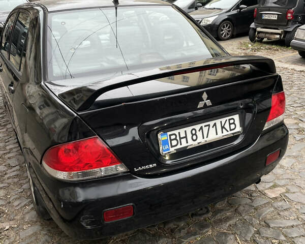 Чорний Міцубісі Lancer, об'ємом двигуна 1.6 л та пробігом 213 тис. км за 3000 $, фото 4 на Automoto.ua